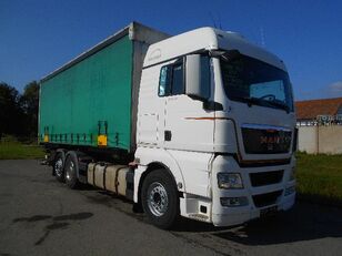 MAN TGX 26.440 tilt truck